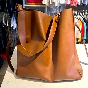 AllSaints large caramel leather hobo bag.